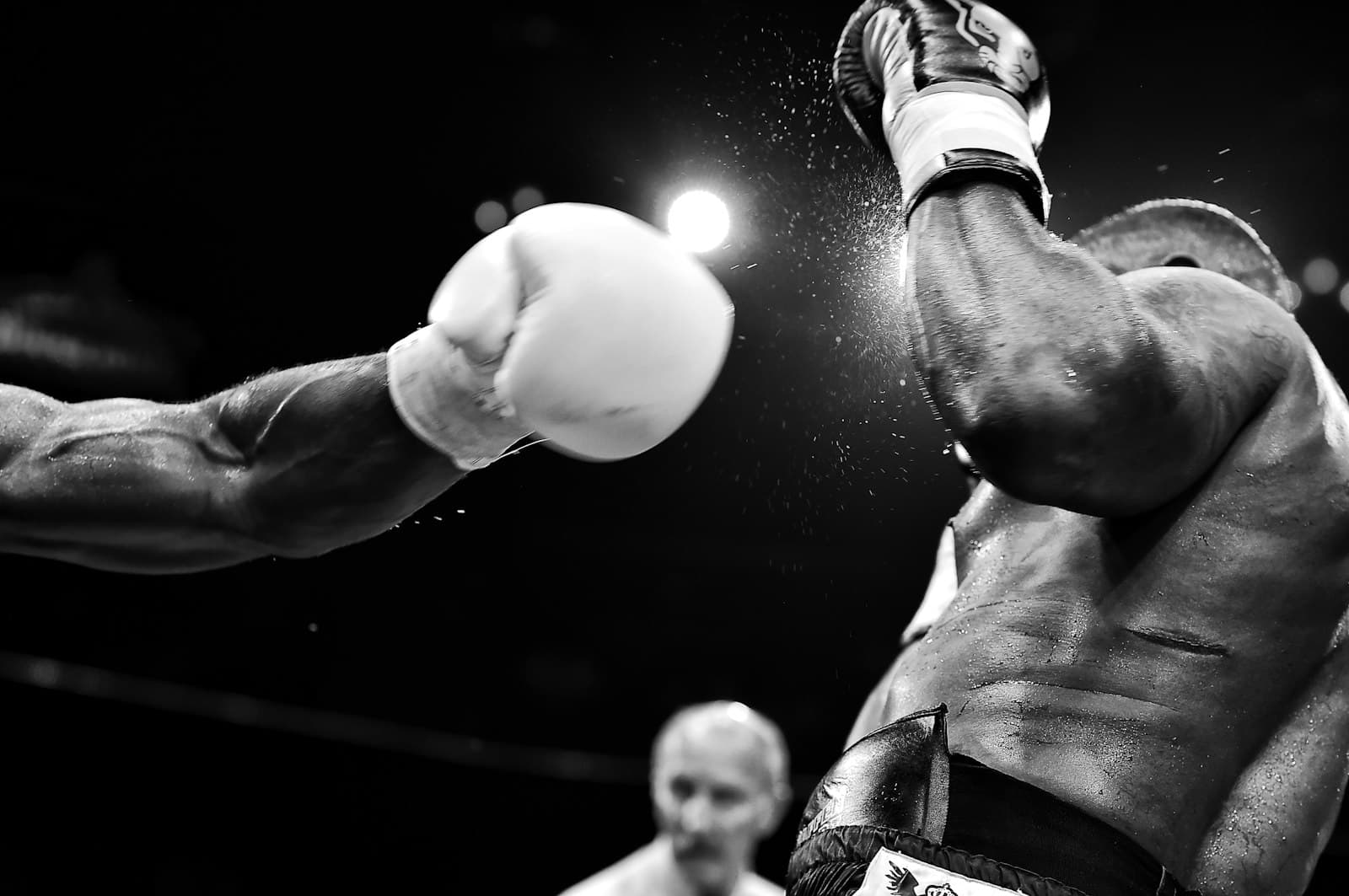 Boxer landing a punch in the ring